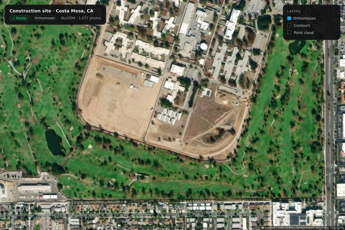 The Costa Mesa construction-site orthomosaic over satellite imagery: the graded pad, site roads, modular buildings and the surrounding fairways, with the map's layers panel.