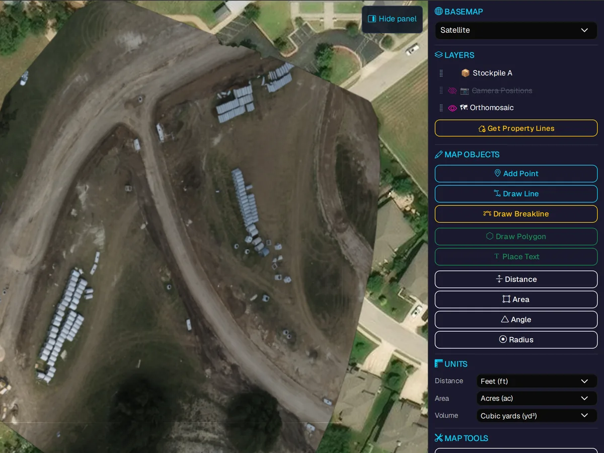Orthomosaic of an earthworks site with stockpile layers, map objects and distance, area and volume tools.